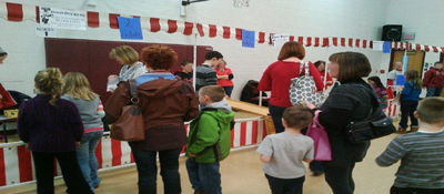 Picture of a Fun Fair being held inside of a school gym